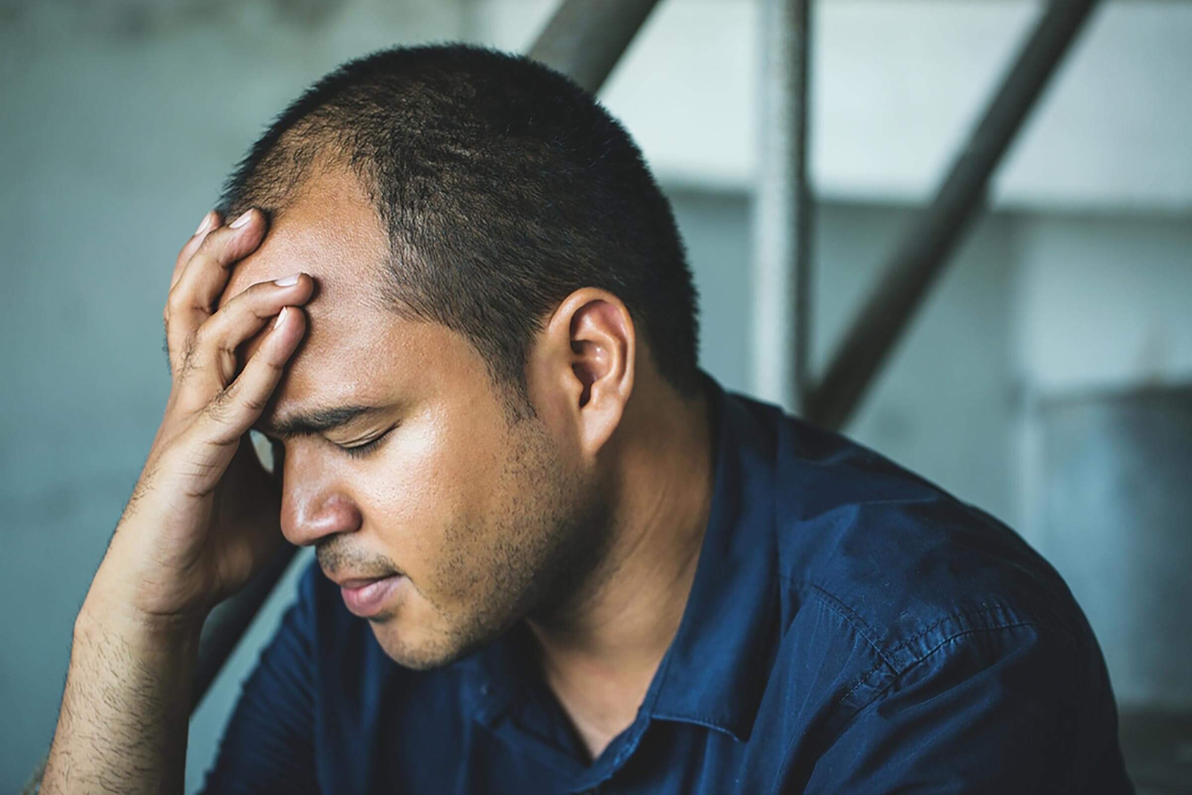 man holding his head