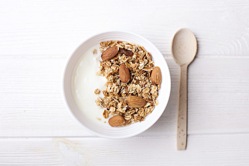 bowl of granola with yogurt and milk