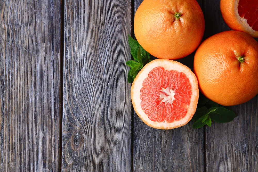 Whole grapefruits and a half grapefruit