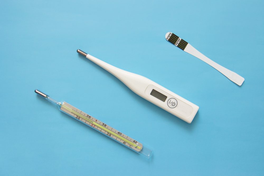 individual color dot oral thermometer, Glass mercury thermometer, digital thermometer on blue background